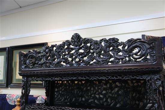 A Chinese black lacquered rosewood cabinet, late 19th century, W.3ft 9in. H.7ft D.1ft 5in.
